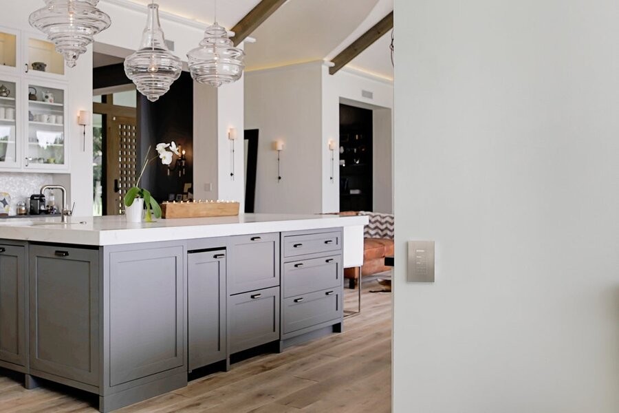 A kitchen space with a professional lighting design featuring several fixtures. Blurb: So, are you ready to upgrade your Austin, TX home’s lighting design but aren’t sure where to start? Don’t approach the design and installation alone! When you work with a team of experts, you can experience a professional design that surpasses anything you would have expected.