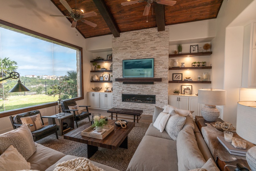 Samsung Frame TV mounted above a fireplace mantle in a living room
